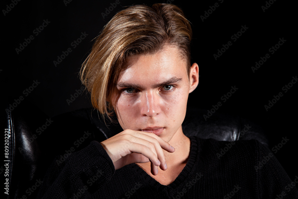 Sad young attractive man relaxing at home. Sad young attractive man relaxing at home.