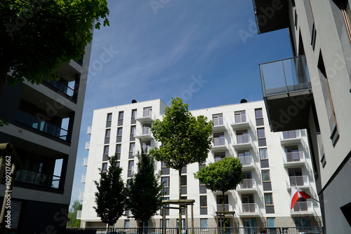 Modern multistorey buildings with balconies and trees