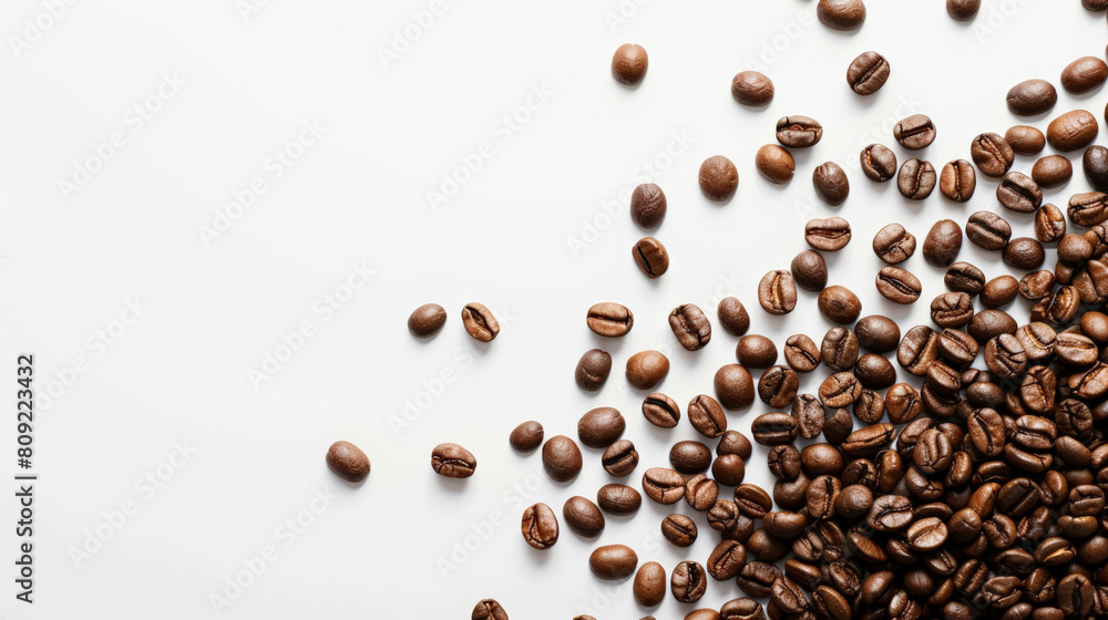 Top view of scattered coffee beans, isolated on a white background with space for text Top view of scattered coffee beans, isolated on a white background with space for text