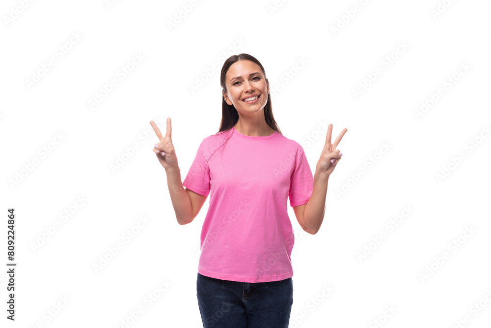 young beautiful model woman with straight black hair dressed in a pink t-shirt feels joy young beautiful model woman with straight black hair dressed in a pink t-shirt feels joy