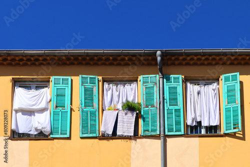 Old building with handing linen in Nice, France