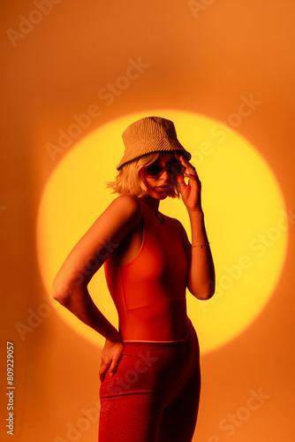 Fashionable portrait of blonde lady in sunglasses posing.  photo