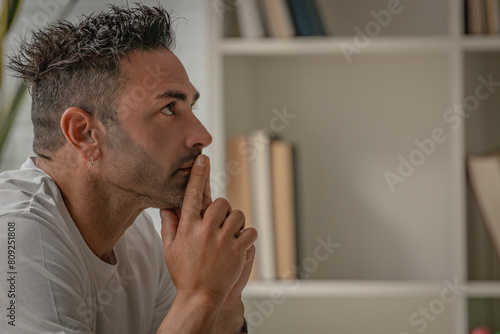 thoughtful man at home making a decision