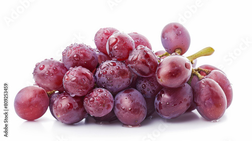 A cluster of ripe red grapes with dew, isolated on a white background 