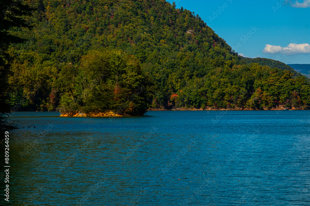 Serene vista of a small island contained in inlet on Watauga Lake in Tennessee Serene vista of a small island contained in inlet on Watauga Lake in Tennessee