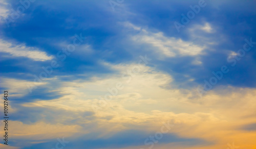 Sunset Wispy Cloud Photo with Yellow Highlights & Deep Blue Sky or Skies Behind