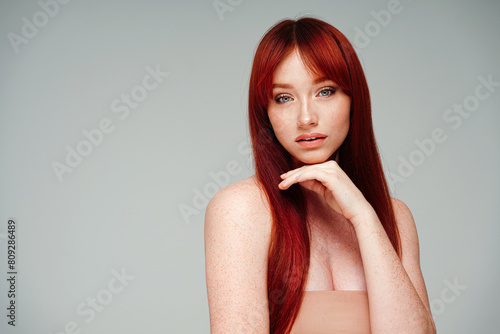 Beautiful natural young woman with freckles on face and body. Beauty portrait. Skincare.