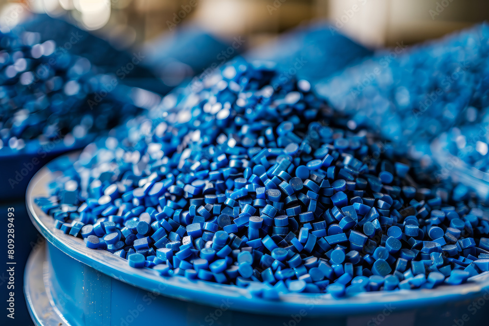 Fototapeta premium Close-up of blue plastic pellets in a recycling facility. AI generated.