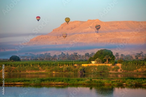 Rising hot air balloons above the temple of Hatshepsut on the banks of the Nile, near Luxor, Egypt, Africa photo