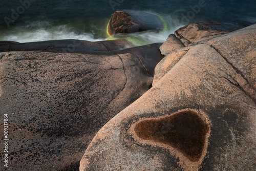 Red granite, rocky coast, surf, long exposure, Havsvidden, Geta, Aland, Aland Islands, Finland, Europe photo