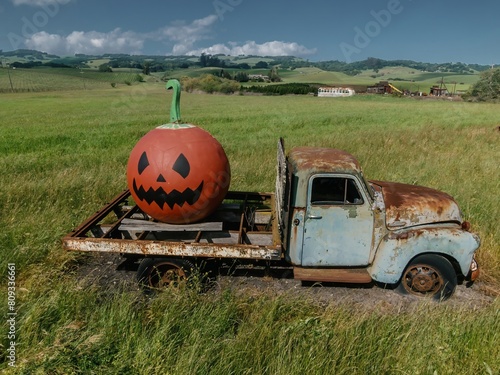 Abandoned rustec pickup truck with giant pumpkin on it. Petaluma, California, United States of America.