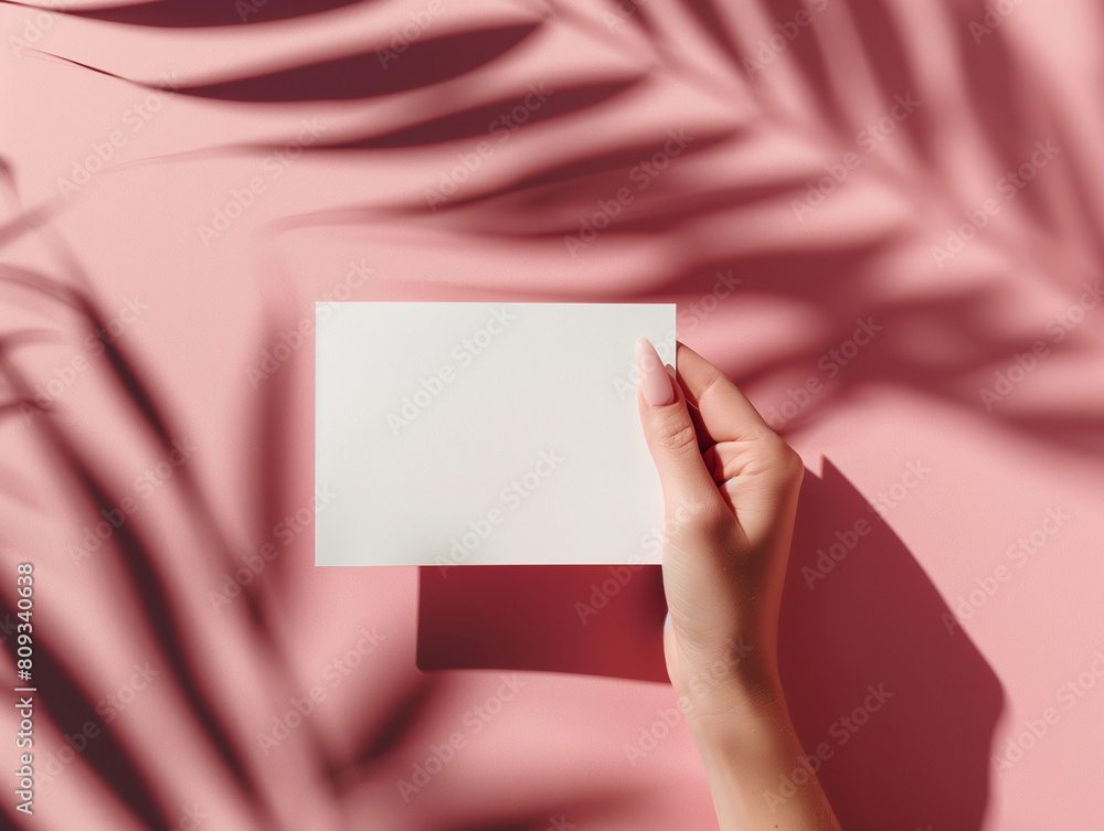 Female manicure finger nails hand holding blank white paper mockup pretty pink resort beach leaves shadows for VIP gift voucher business card promo mock up simple template brand minimal empty design Female manicure finger nails hand holding blank white paper mockup pretty pink resort beach leaves shadows for VIP gift voucher business card promo mock up simple template brand minimal empty design