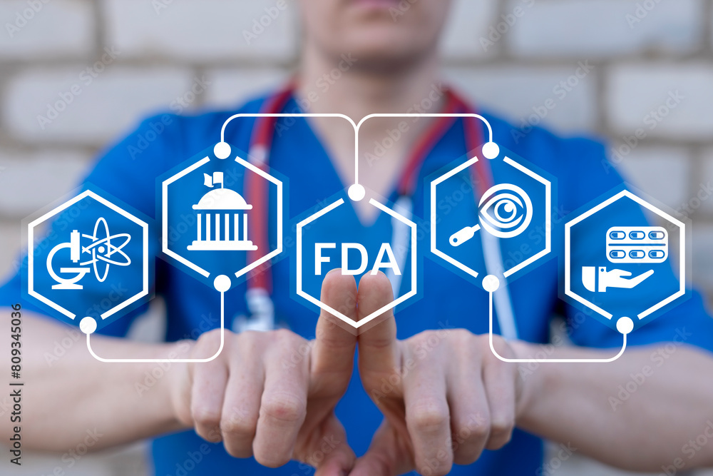 Doctor working on virtual touch screen presses abbreviation: FDA. Food and Drug Administration ( FDA ) Department Service Medical Concept.
