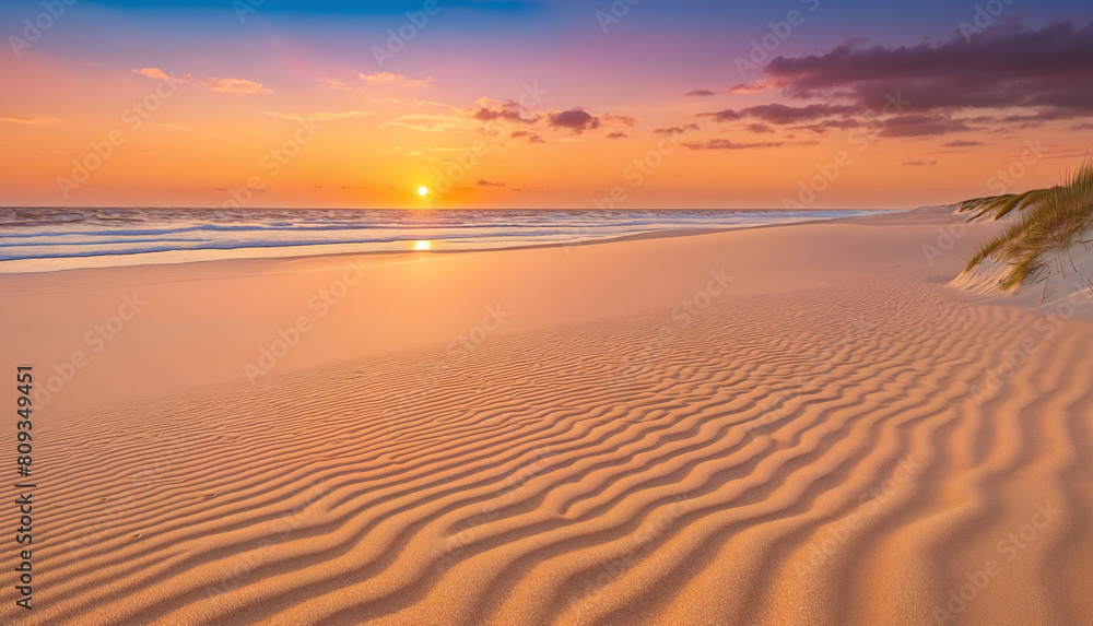 A beach scene at sunset, with the sun setting over the ocean. The beach is sandy. The sky is filled with clouds, creating a beautiful and serene atmosphere.