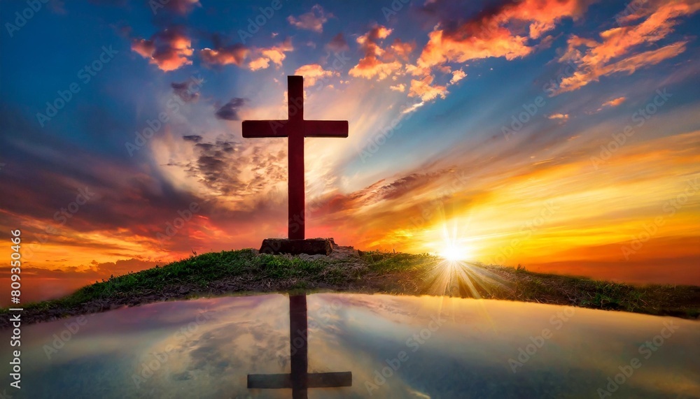 christian easter conceptual religious symbol on a colorful sky at sunset