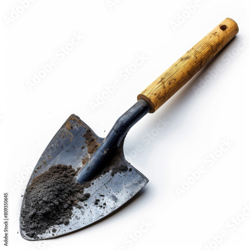 An old, dirty gardening shovel with a wooden handle, isolated on a white background, showing signs of use.