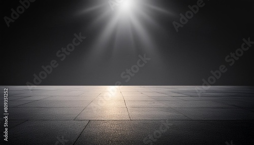 empty spot lit concrete floor dark background