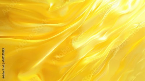 Close-up of smooth, flowing, yellow satin-like fabric with elegant ripples