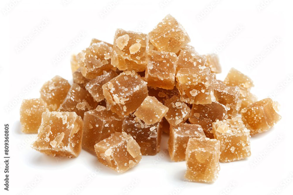 a pile of sugared sugar cubes on a white surface a pile of sugared sugar cubes on a white surface