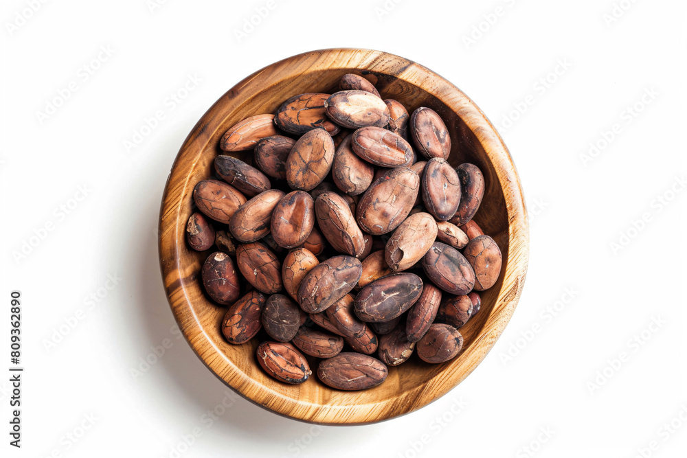 a wooden bowl filled with nuts on top of a white surface a wooden bowl filled with nuts on top of a white surface