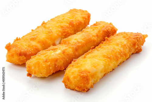 a group of fried fish sticks on a white surface