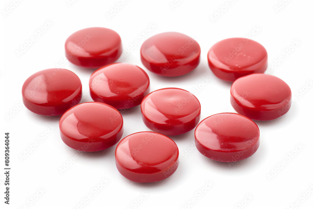 a bunch of red buttons on a white surface a bunch of red buttons on a white surface