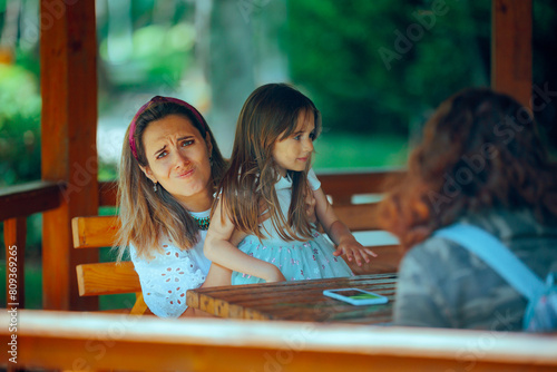 Mother Have a Conversation While her Daughter Demands Attention. Clingy toddler not allowing her mom to speak with her friend
 photo