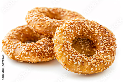 two sesame bagels with sesame seeds on a white background © onThKim