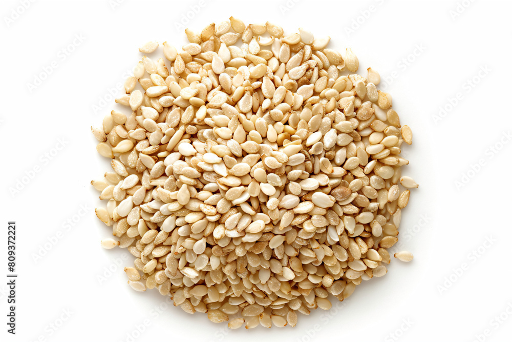 a pile of sesame seeds on a white surface a pile of sesame seeds on a white surface