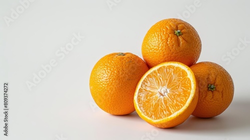 fresh sunkist oranges on clean isolated background photo