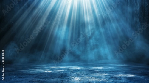 Dark blue background with light rays  glowing and shining on the floor  creating an atmospheric effect.