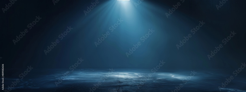 Dark blue background with light rays, glowing and shining on the floor, creating an atmospheric effect. Dark blue background with light rays, glowing and shining on the floor, creating an atmospheric effect.