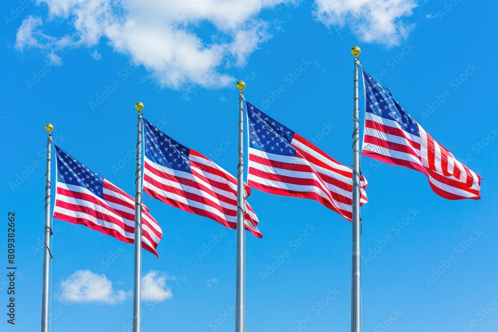 American flags waving in the wind on a background of blue sky. American flags waving in the wind on a background of blue sky.