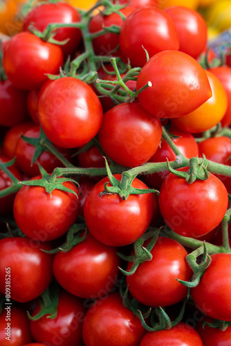 fresh ripe red cherry tomatoes background.