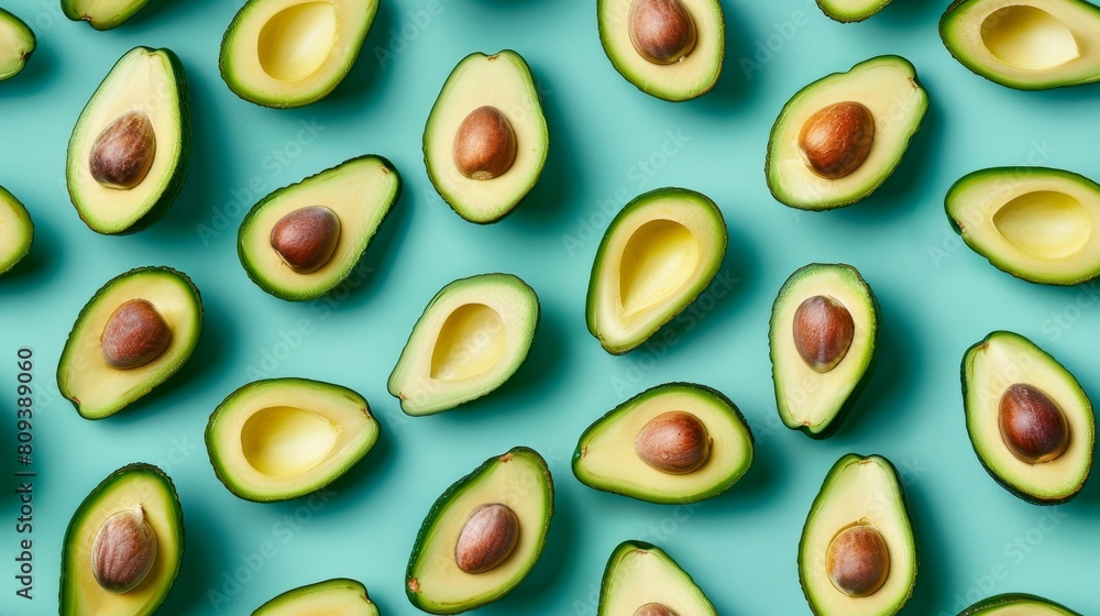 Avocado slices and whole avocados arranged in a whimsical pattern, captured from above against a cyan backdrop, isolated Avocado slices and whole avocados arranged in a whimsical pattern, captured from above against a cyan backdrop, isolated