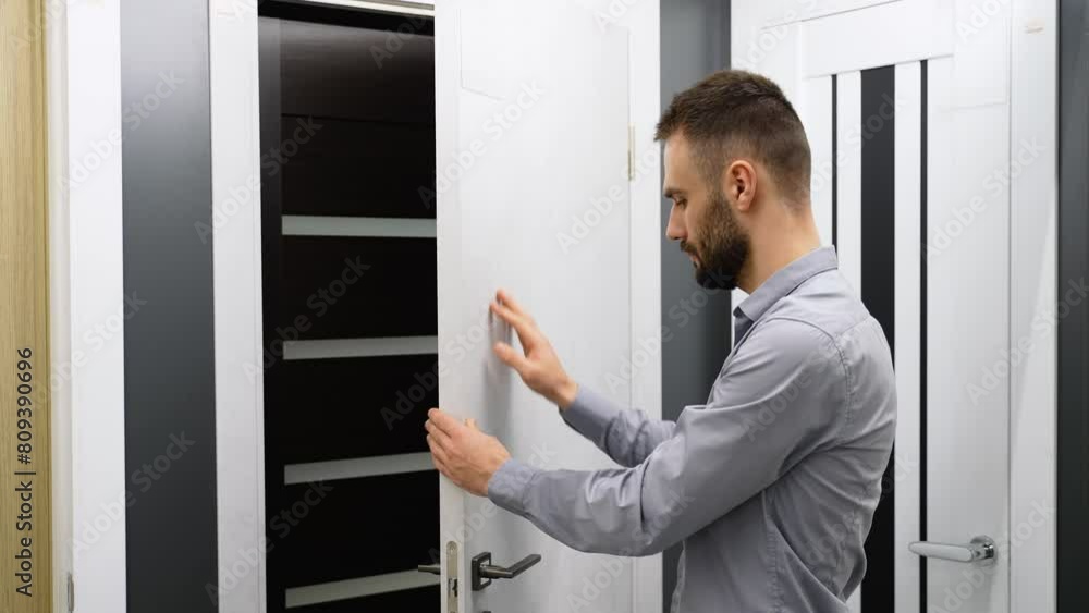 A man choosing front doors in store
