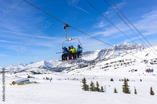 Skiers on the chairlift at Sunshine Village Ski Resort in Banff National Park.