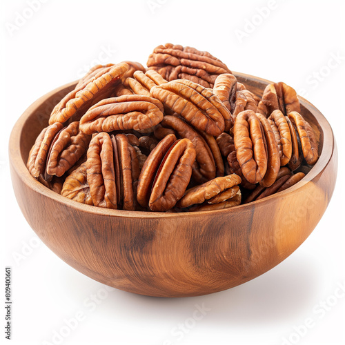 there is a wooden bowl filled with pecans on a white background
