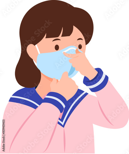 Female student making sure the position of surgical mask properly