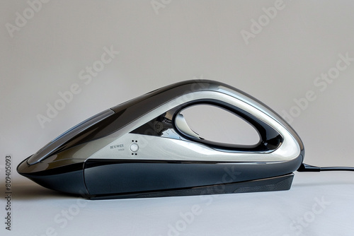 A compact travel iron with dual voltage capability, suitable for use in different countries.