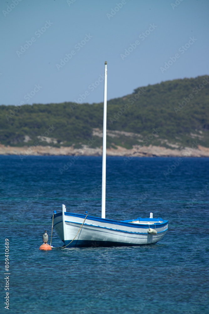 Fototapeta premium boat on the sea, Gozzo in the bay of Tramariglio, Porto Conte Park, AMP Capo Caccia. Alghero. Sardinia, Italy