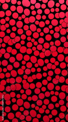 A red and black background filled with various sized circles in a repetitive pattern