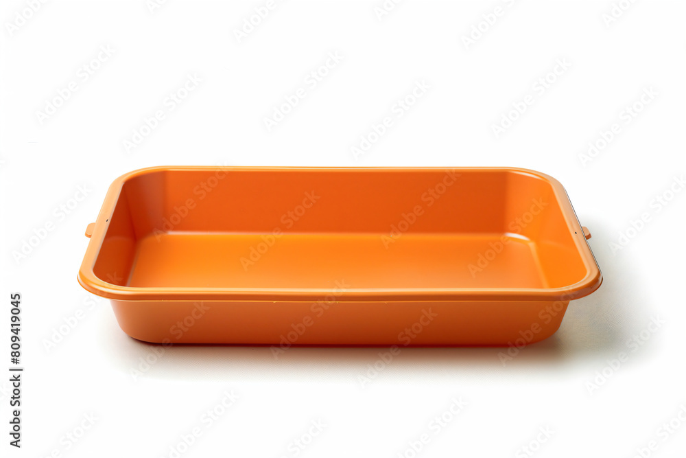 a orange rectangular dish on a white surface a orange rectangular dish on a white surface
