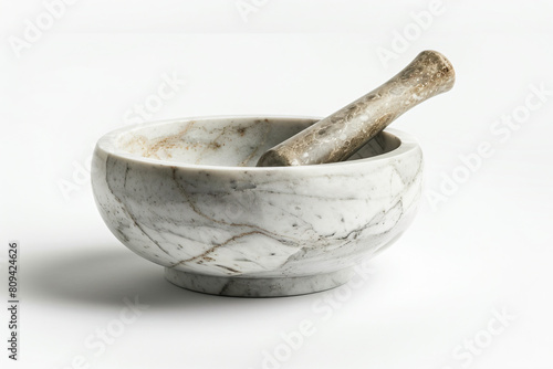 a marble mortar and pestor in a white bowl