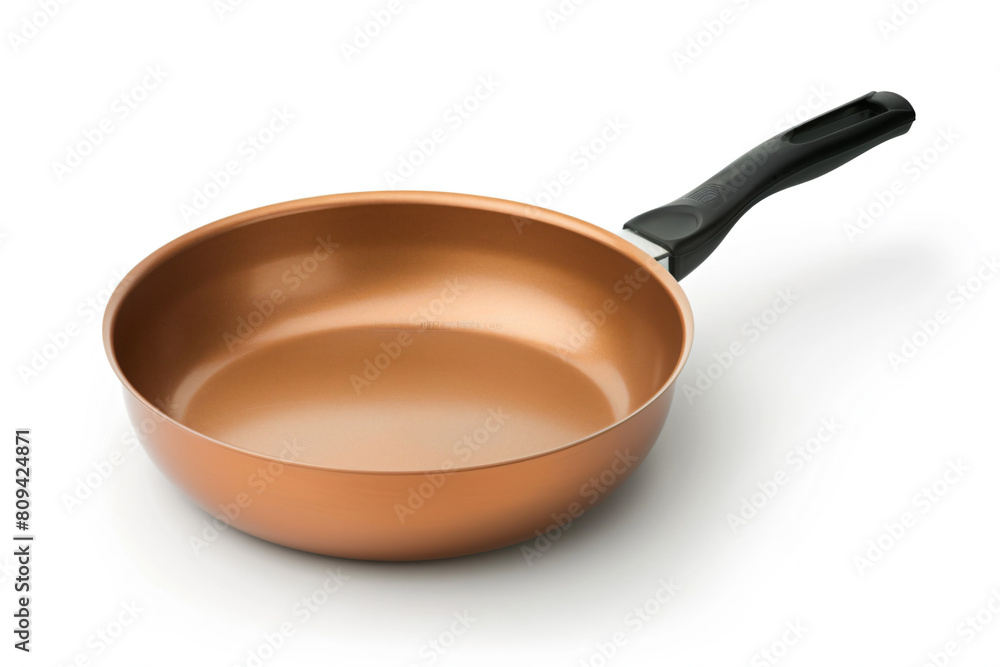 a pan with a handle on a white surface a pan with a handle on a white surface