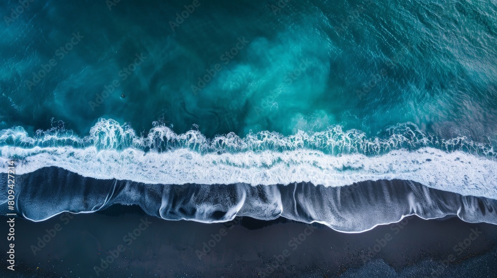 Fototapeta premium Dramatic Aerial View of a Black Sand Beach and Waves
