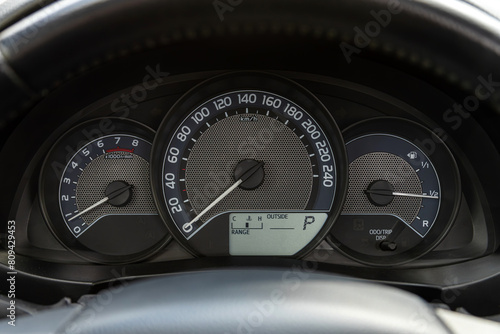 Black car speedometer. Close up shot of the dashboard a car. © Виталий Сова