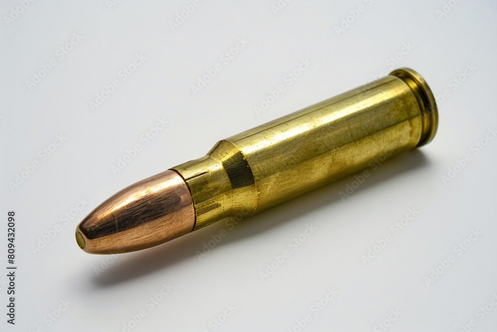 a bullet with a bullet head on a white surface