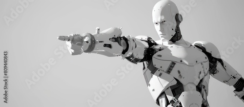A white robot is pointing with its finger on a white background. © diwek
