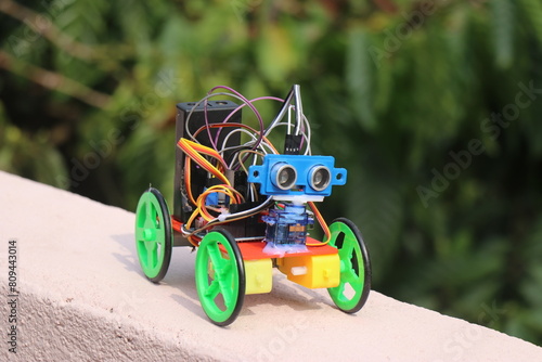 Small robotic car made using simple electronic components like dc motor and ultrasonic sensor controlled by a micro controller